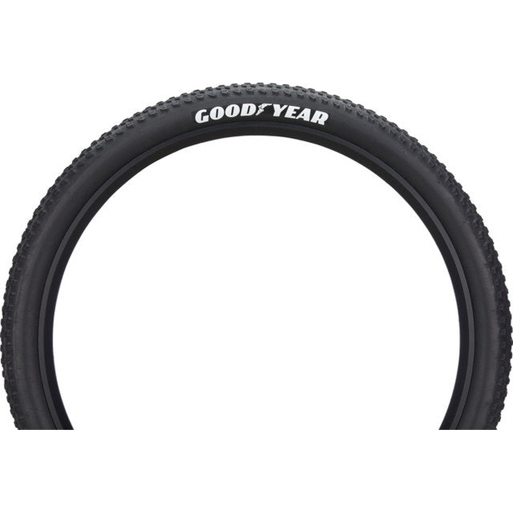 Goodyear bicycle tire with black sidewall and knobby tread pattern on white background