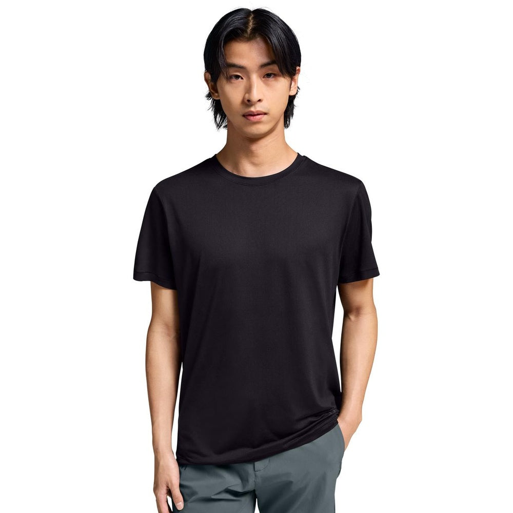 Asian male model wearing black On Movement-T shirt with gray shorts on white background