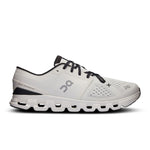 On Cloud X 4 running shoe in ivory and black colorway with distinctive cloud sole