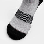 Close-up of Thorlos Experia Green Quarter Crew Sock toe box showing gray body and black reinforced toe