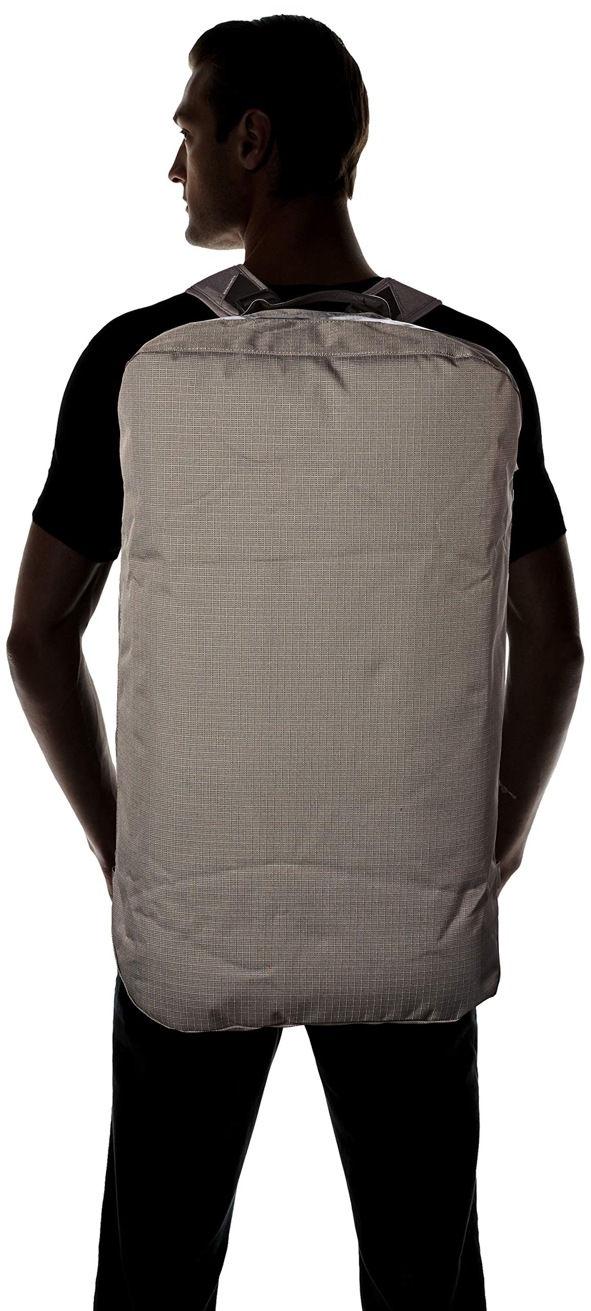 Person wearing Patagonia Black Hole Duffel backpack in hex grey color showing back view
