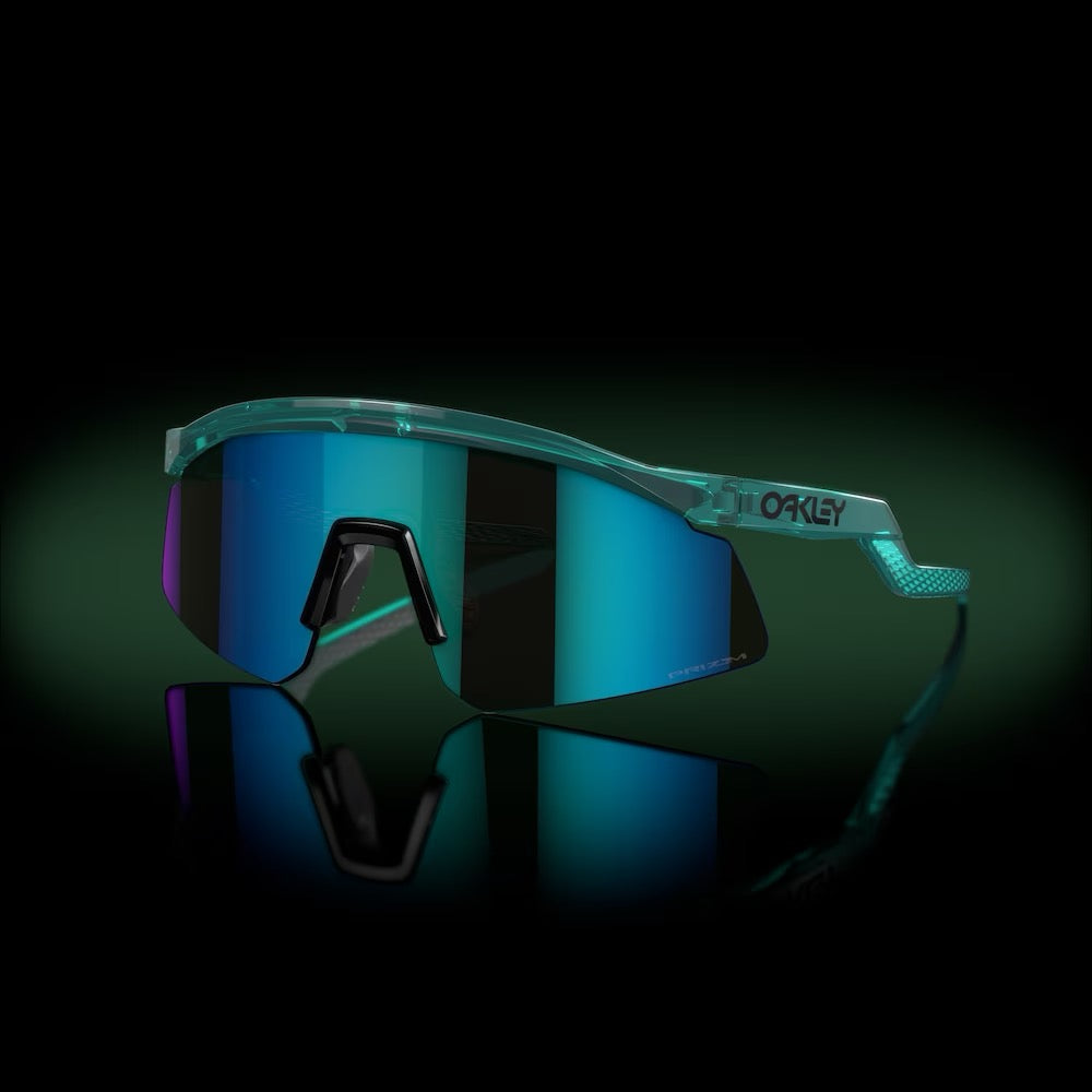 Oakley Hydra sunglasses with translucent teal frame and blue prizm sapphire lenses