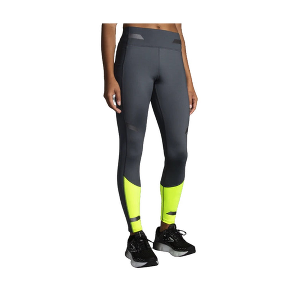 Brooks women's running tights in asphalt gray with bright yellow nightlife lower legs