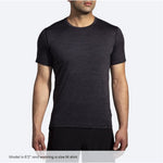 Brooks Luxe Short Sleeve shirt in heather black worn by male model on white background