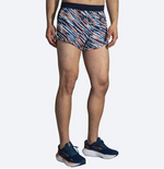 Brooks Sherpa 3-inch Split Running Shorts in orange pop multicolor stripe pattern on male model