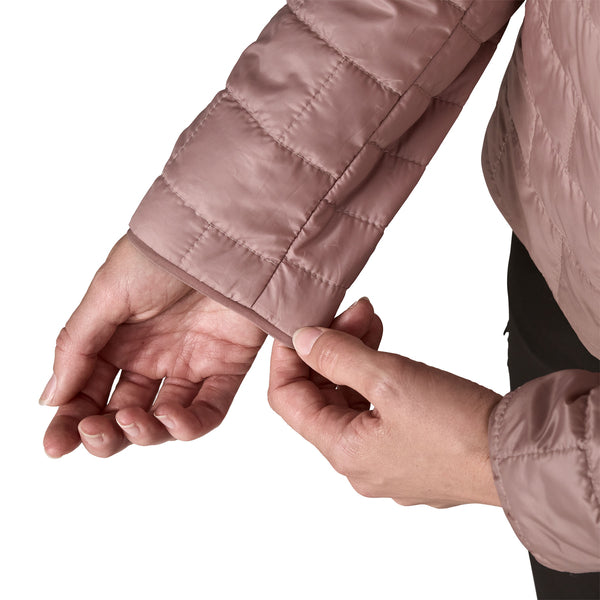 Patagonia Nano Puff Jacket sleeve cuff detail in Stingray Mauve, hands adjusting cuff