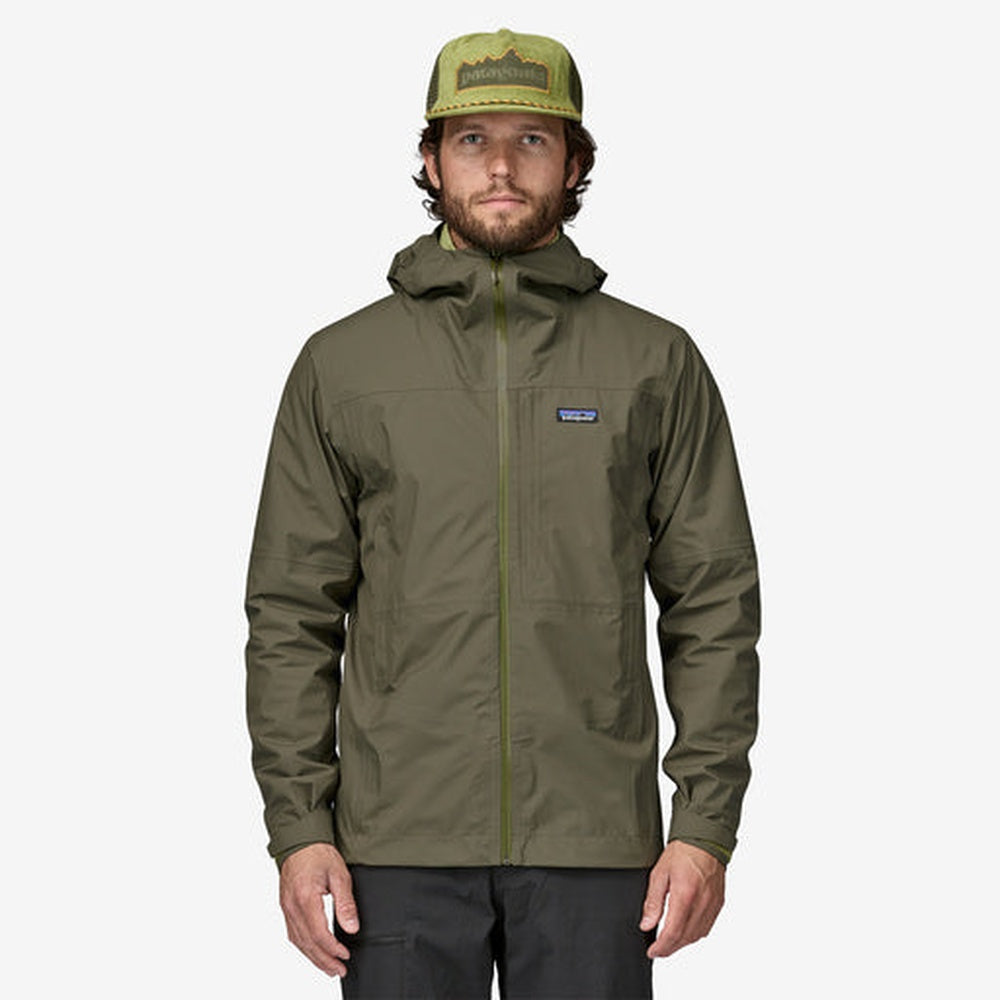 Man wearing Patagonia Boulder Fork Rain Jacket in olive green with hood