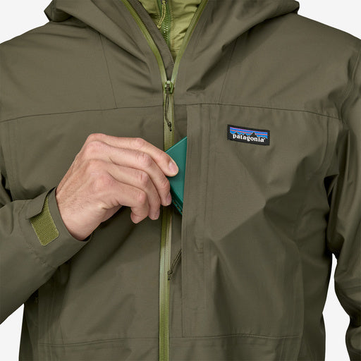 Patagonia men's olive green rain jacket with hood and chest pocket detail