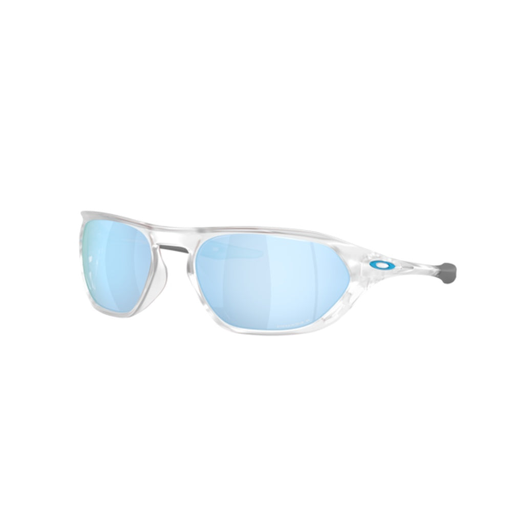 Oakley Cage Jacket sunglasses with clear frame and blue polarized lenses, angled view
