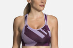 Brooks Rebound Racer Sport Bra in violet purple with geometric pattern worn by model