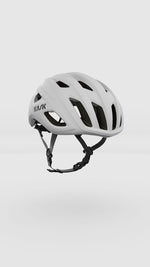 Kask Mojito Cubed white cycling helmet with ventilation holes and black straps