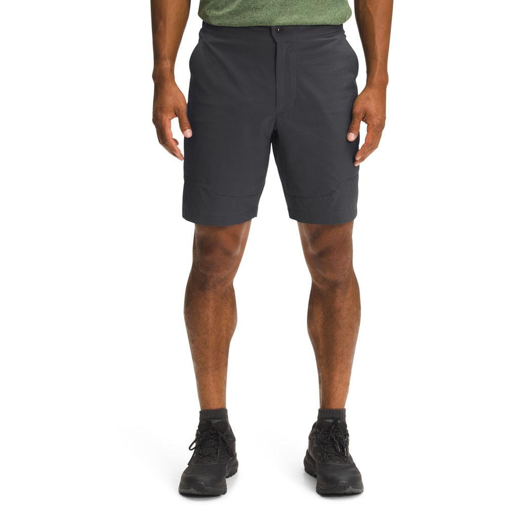 Man wearing dark grey North Face Paramount Active shorts with green shirt