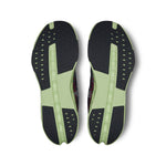 On Cloudsurfer Next running shoes bottom view showing black and lime green sole pattern