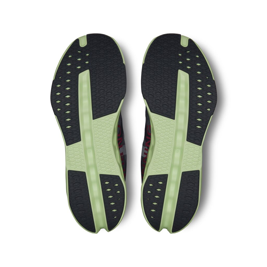 On Cloudsurfer Next running shoes bottom view showing black and lime green sole pattern