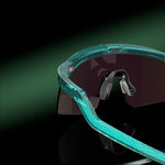 Oakley Hydra sunglasses with translucent teal frame and dark tinted lenses