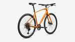 Orange Specialized Sirrus X 3.0 hybrid bicycle on white background