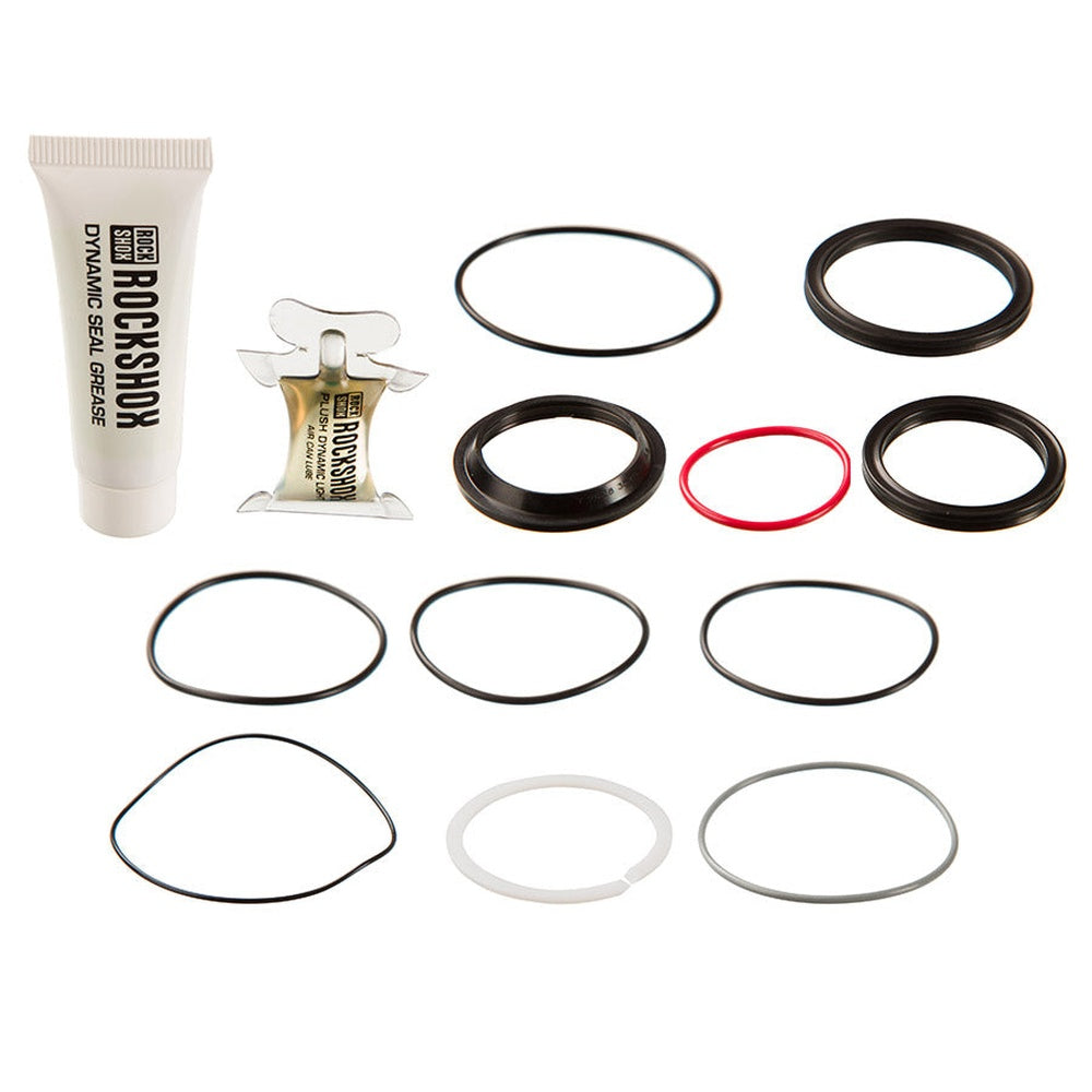 RockShox service kit with grease tube and various black, red, and clear seals and o-rings