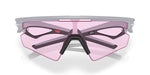 Oakley sports sunglasses with matte gray frame and pink tinted lenses