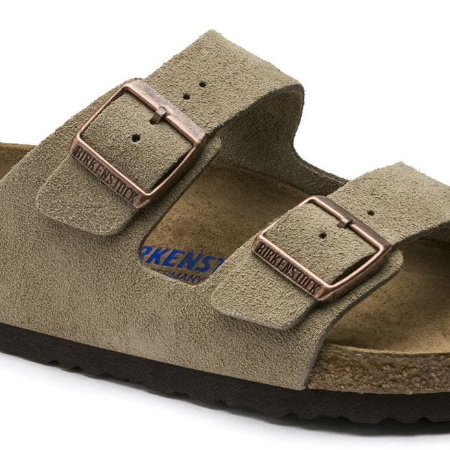 Birkenstock Arizona sandals in taupe suede with copper buckles on white background