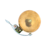 Origin8 brass bicycle bell with chrome mounting bracket on white background