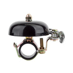 Black bicycle bell with chrome clamp mechanism for handlebar mounting