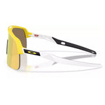 Oakley Sutro Lite matte yellow sunglasses showing white temples and Prizm 24K lens from side angle