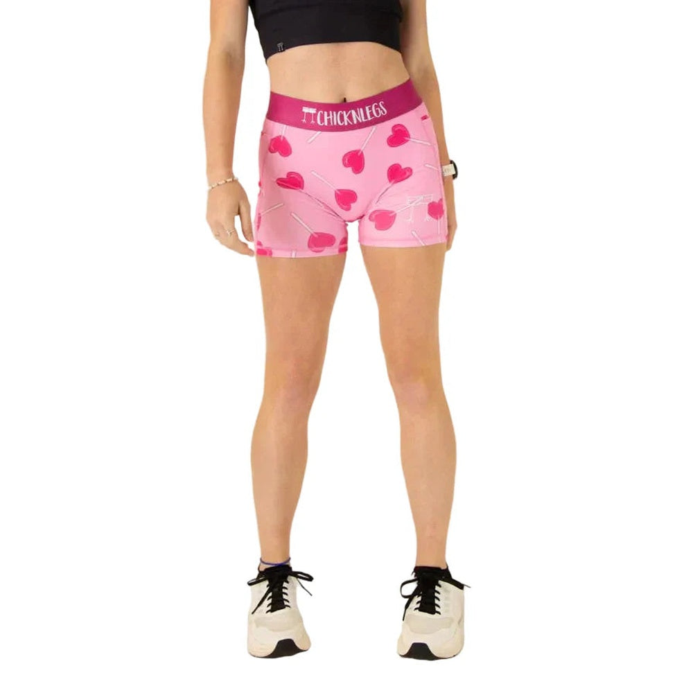 Pink compression shorts with heart pattern and ChicknLegs waistband on model