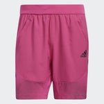 Adidas pink athletic shorts with elastic waistband and mesh detail panels