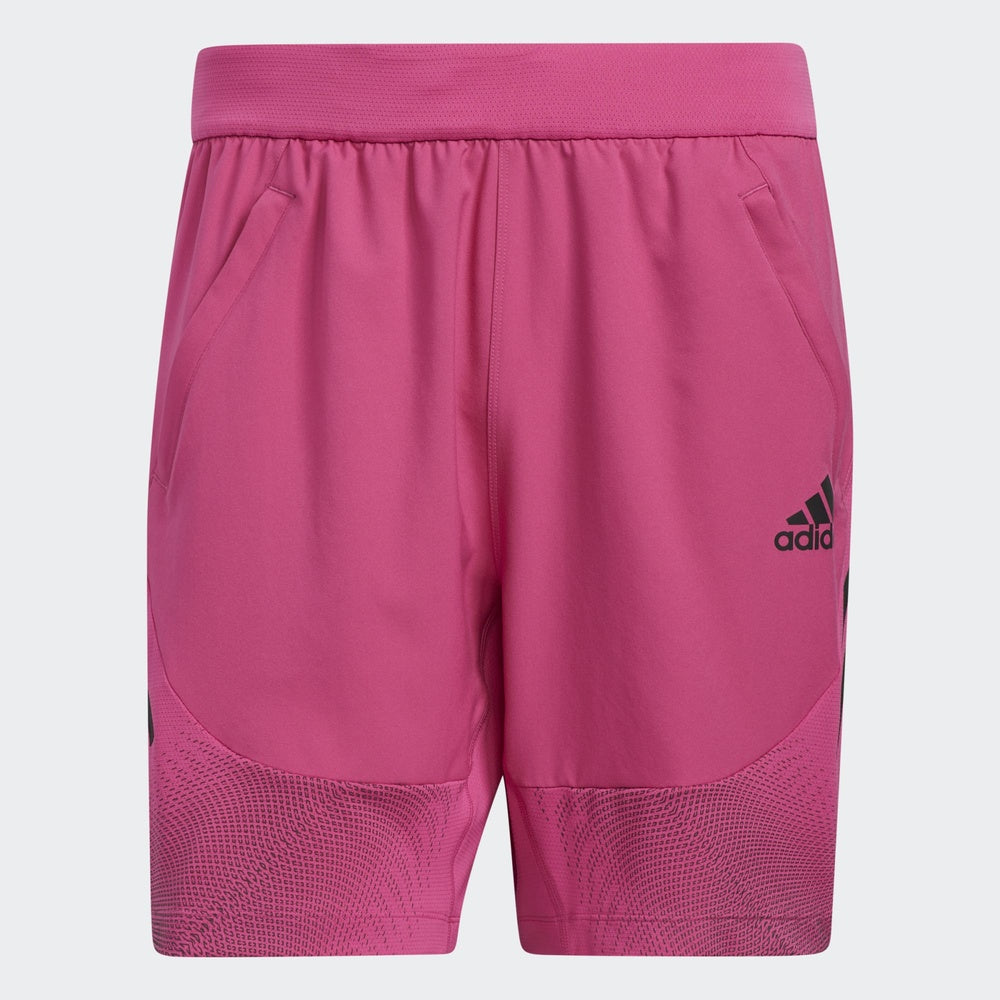 Adidas pink athletic shorts with elastic waistband and mesh detail panels