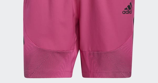 Adidas pink athletic shorts with textured mesh panels and logo