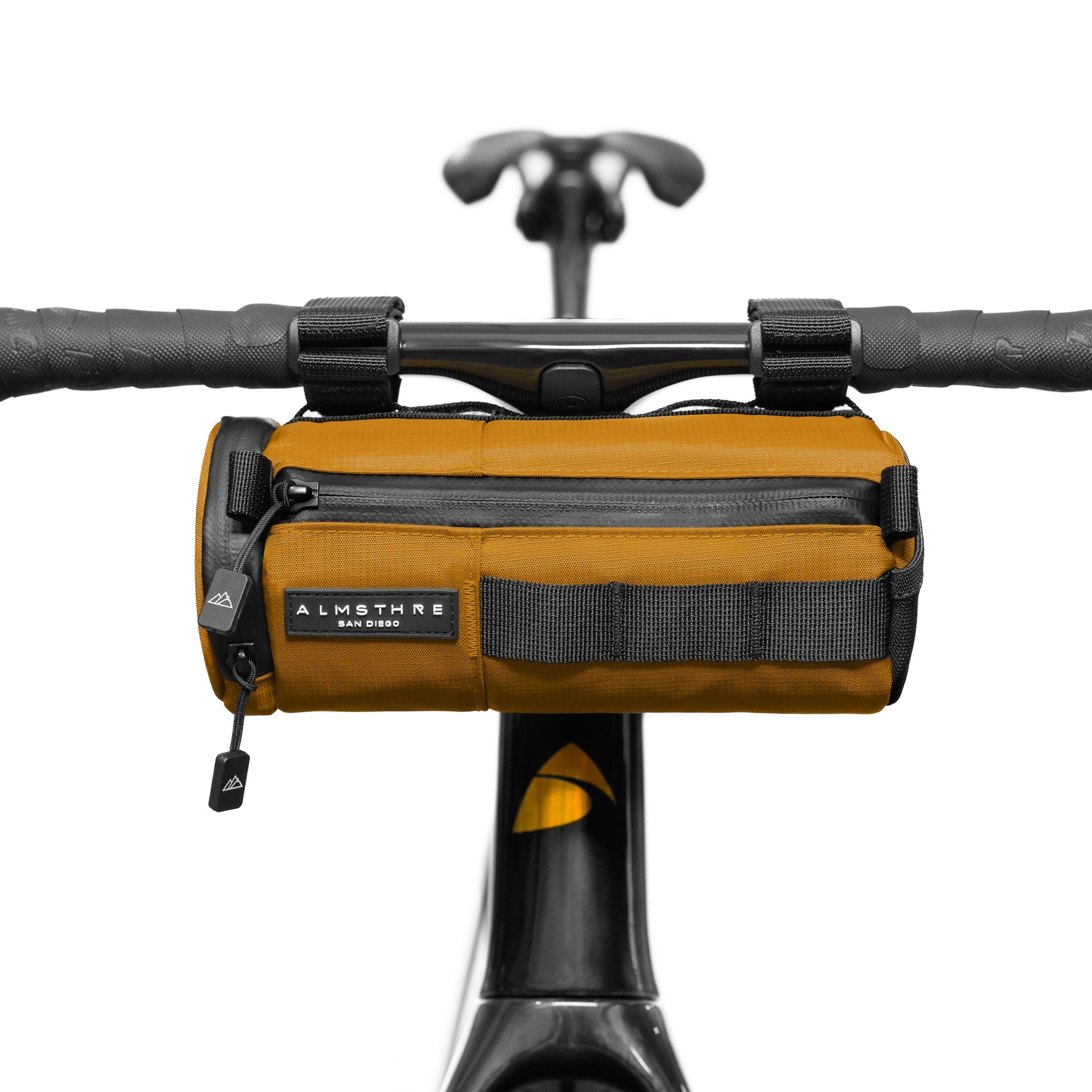 ALMSTHRE Compact Bar Bag in California Gold mounted on bicycle handlebars
