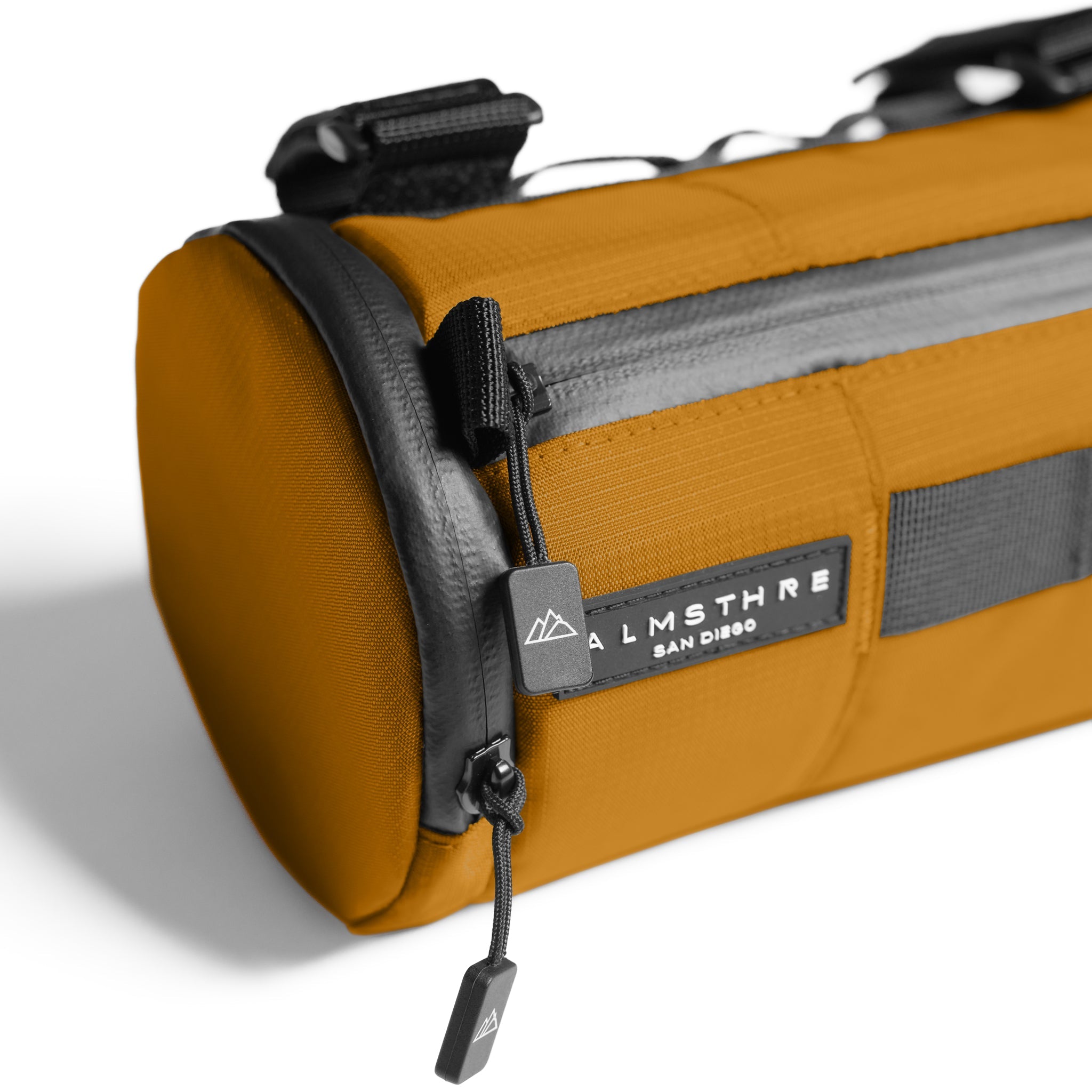 ALMSTHRE orange compact bar bag with gray reflective strip and black mounting hardware