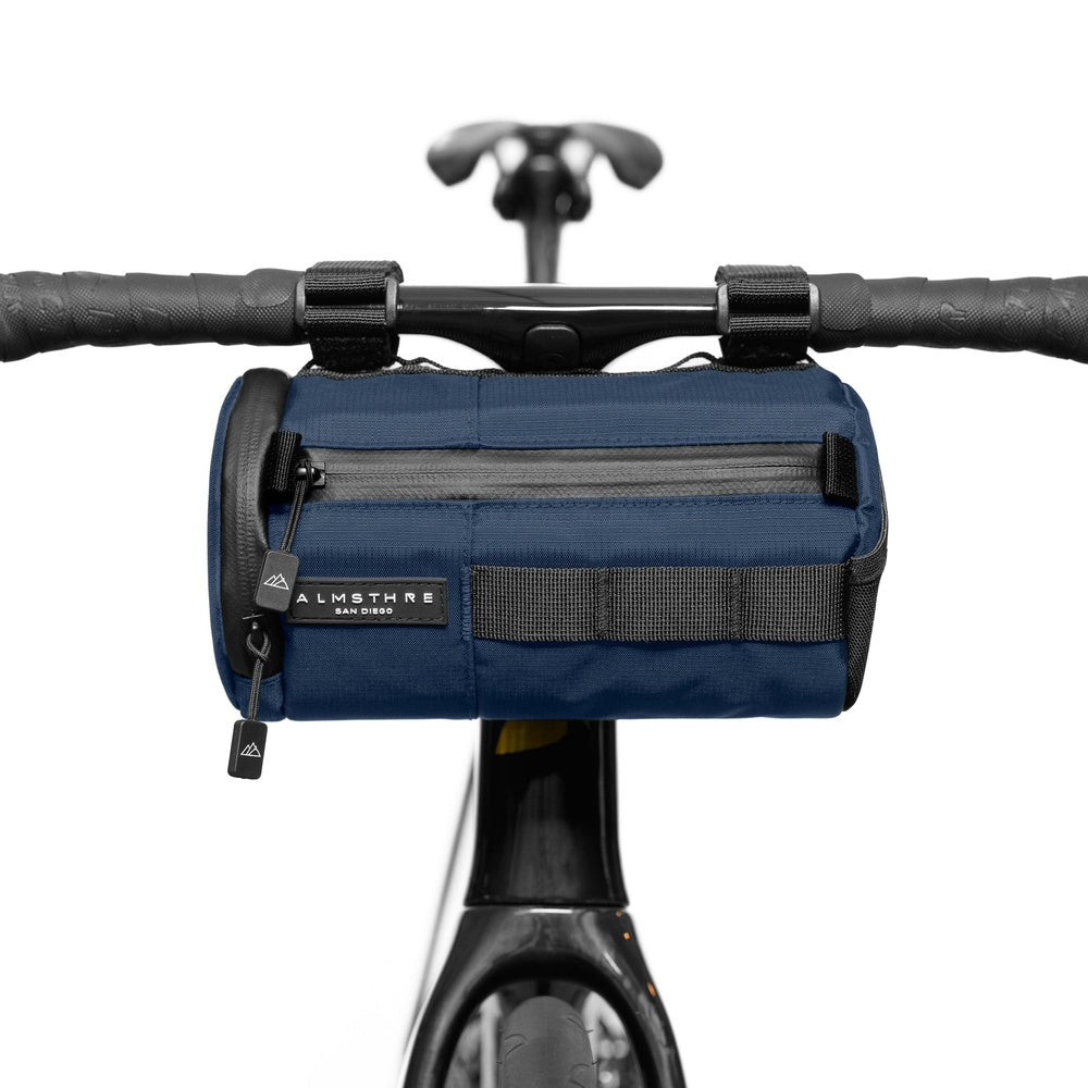 ALMSTHRE Signature Bar Bag in navy blue mounted on bicycle handlebars