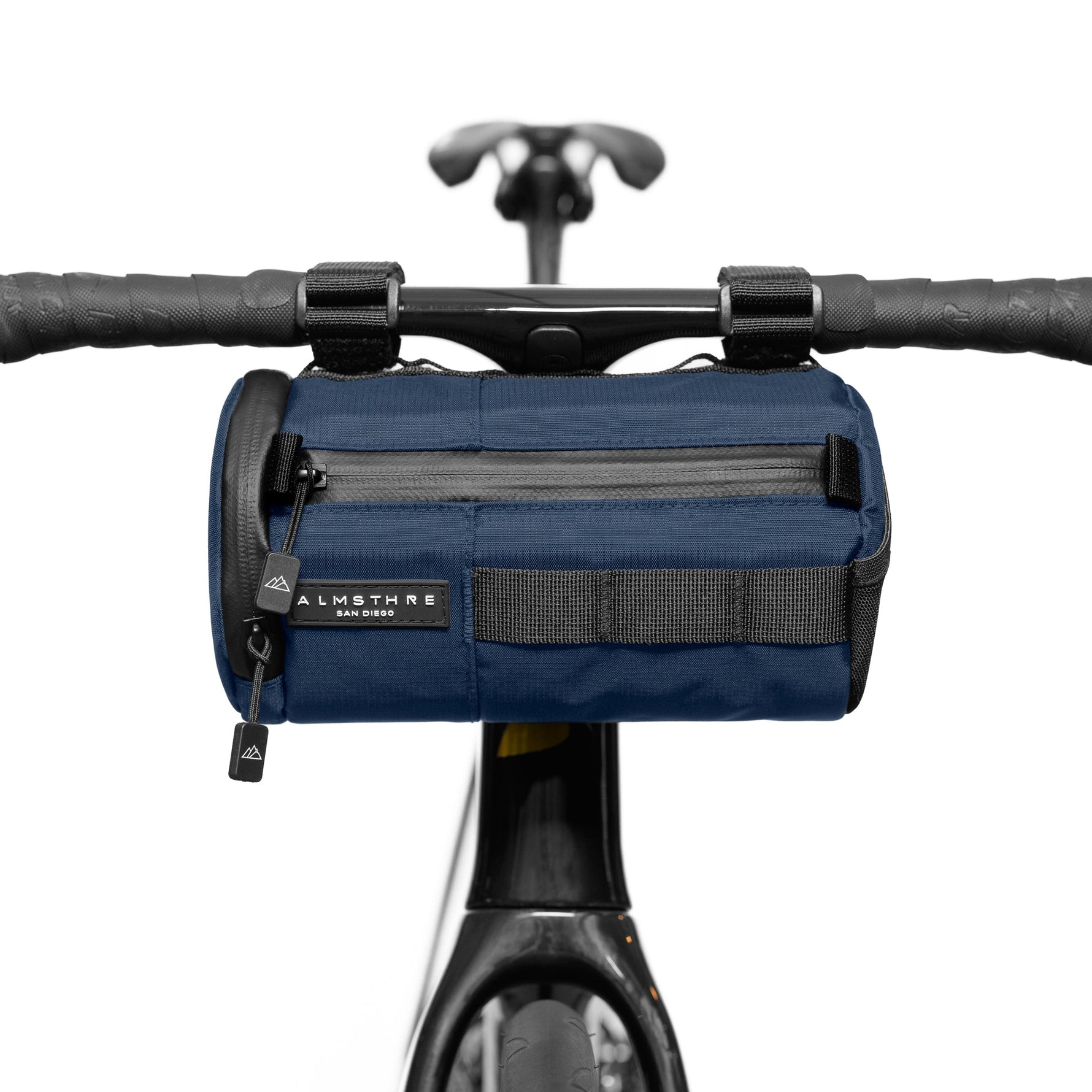 Navy blue Almsthre bicycle handlebar bag mounted on bike handlebars with black straps