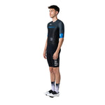 Male cyclist wearing black Gobik Attitude 2.0 triathlon suit with blue details
