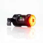 Lezyne bicycle rear light with red LED illuminated, black and red body