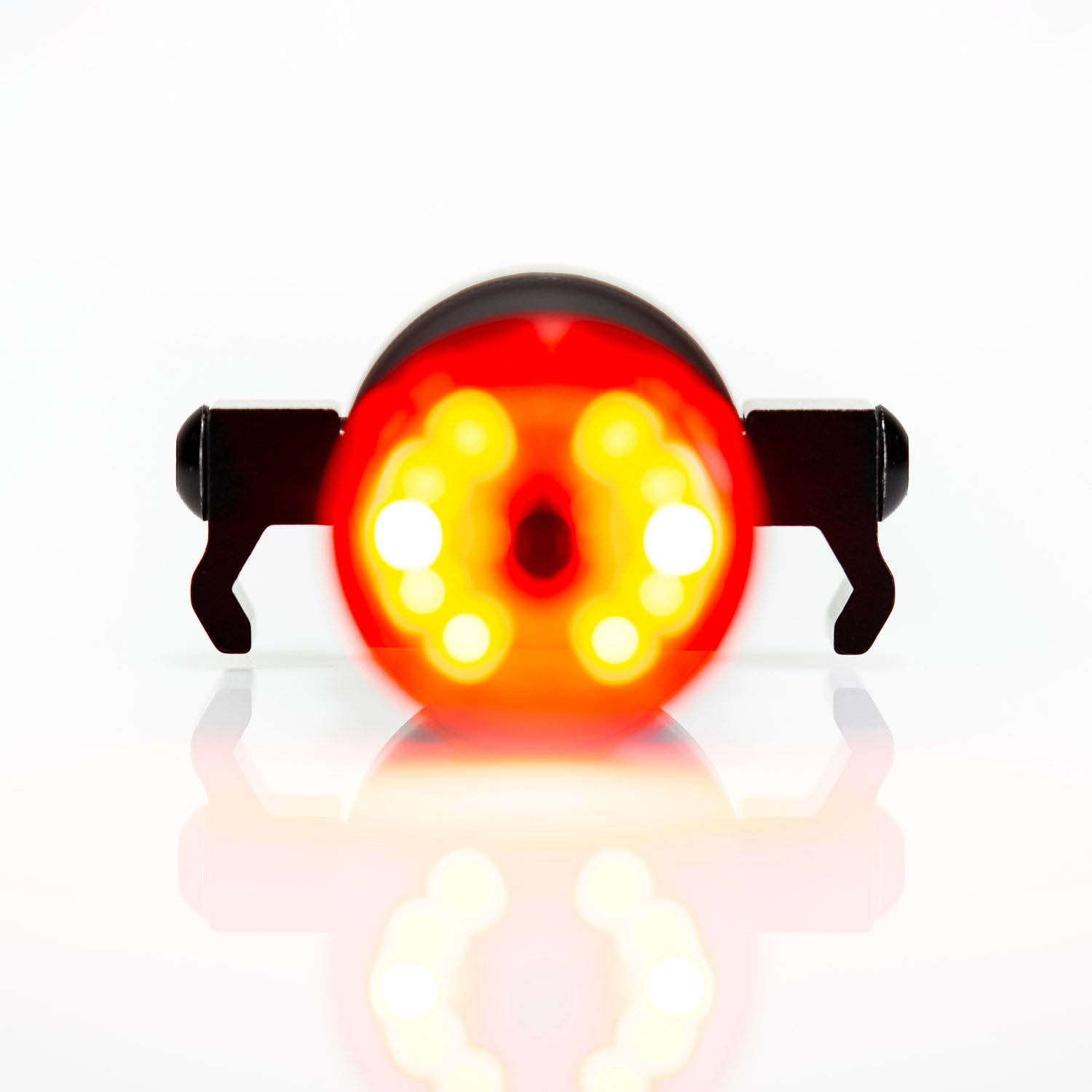 Lezyne bike tail light with bright red and yellow LED pattern illuminated