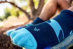 Balega navy blue no-show running sock with light blue heel and toe