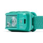 Black Diamond Cosmo Dual Fuel headlamp side angle view showing USB-C charging port in teal green
