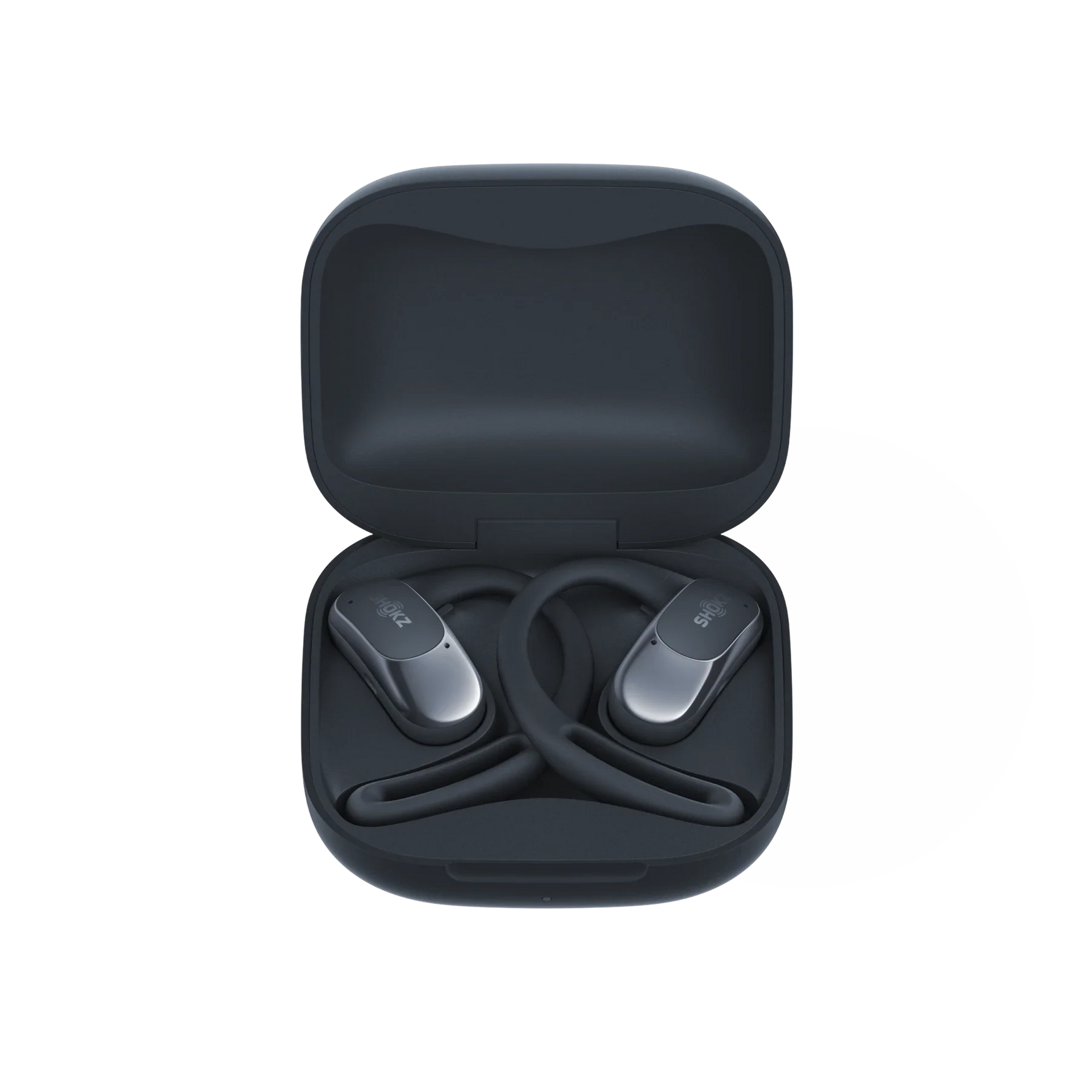 Black Shokz wireless earbuds displayed in open charging case on white background