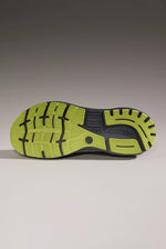 Brooks Ghost 16 running shoe sole showing grey upper and bright lime outsole