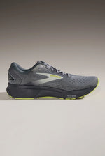 Brooks Ghost 16 men's running shoe in grey with lime accents on gradient background