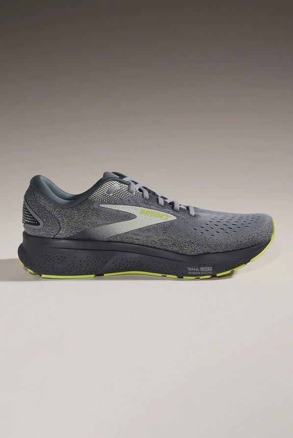 Brooks Ghost 16 men's running shoe in grey with lime accents on gradient background