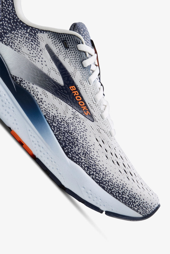Brooks Ghost 16 running shoe in white and grey with orange branding