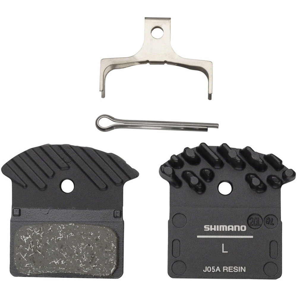 Shimano J05A Resin brake pads with cooling fins, spring clip, and retention hardware