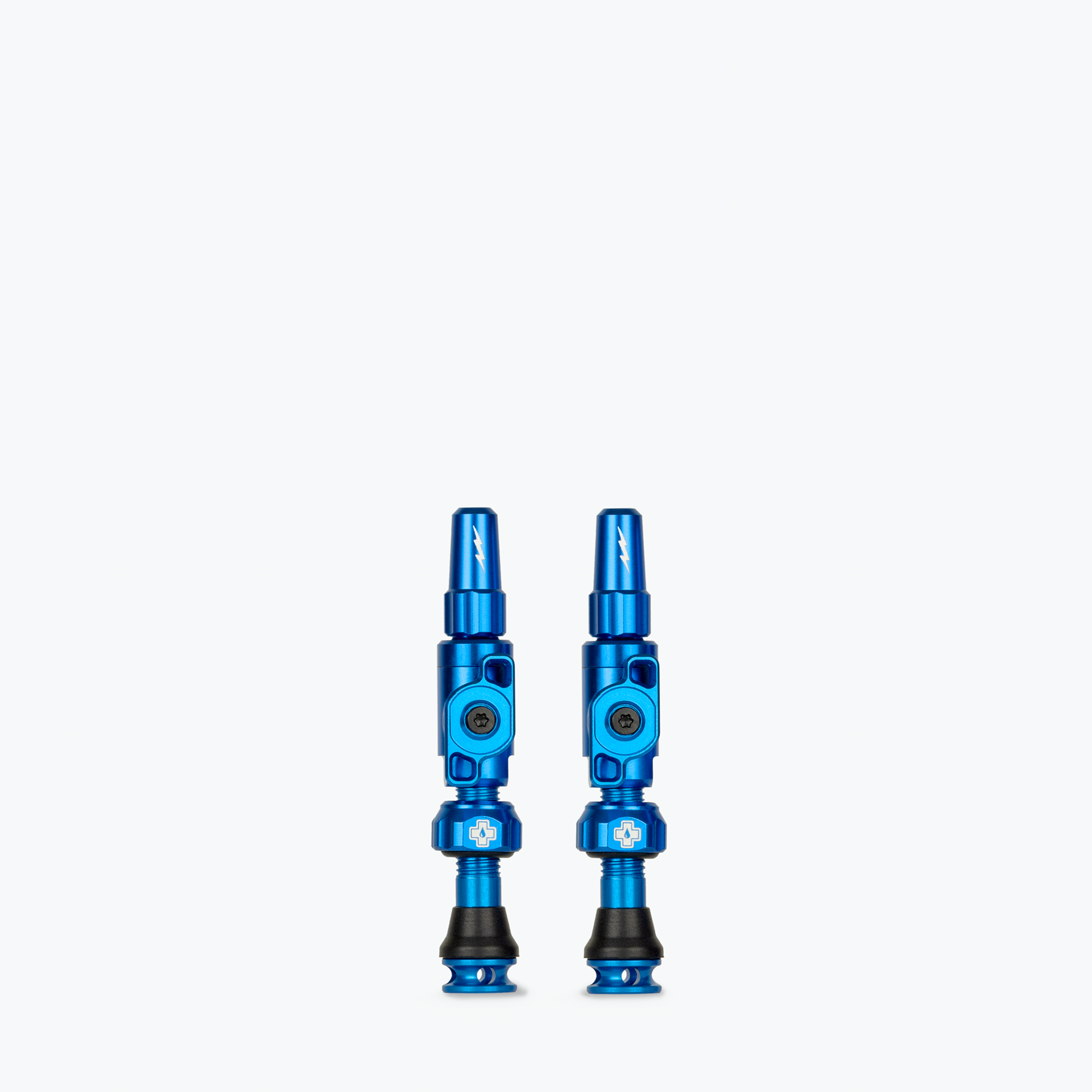 Two blue Muc-Off Big Bore Lite Tubeless Presta Valves on white background
