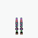Two Muc-Off Big Bore Lite tubeless Presta valves with rainbow iridescent finish