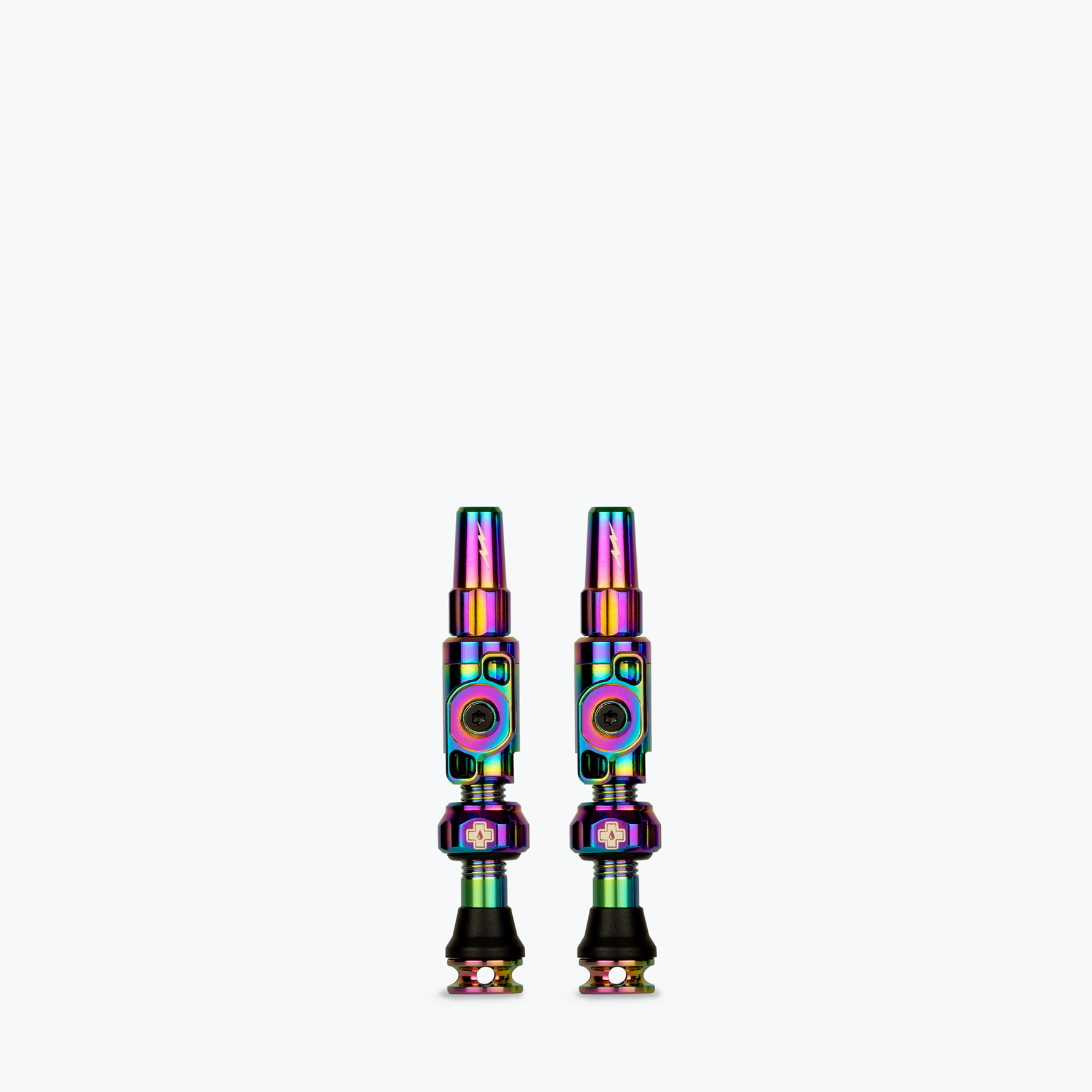 Two Muc-Off Big Bore Lite tubeless Presta valves with rainbow iridescent finish