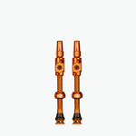 Muc-Off Big Bore Lite Tubeless Presta Valves in orange anodized finish