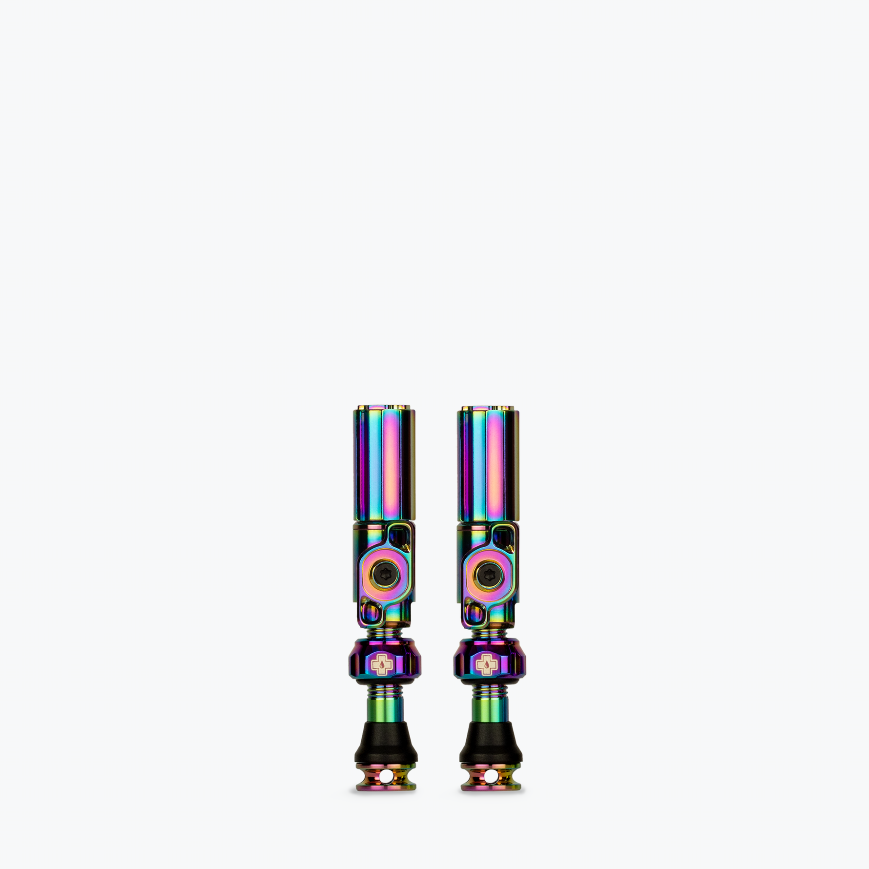 Two Muc-Off Big Bore Hybrid Tubeless Presta Valves with rainbow iridescent finish